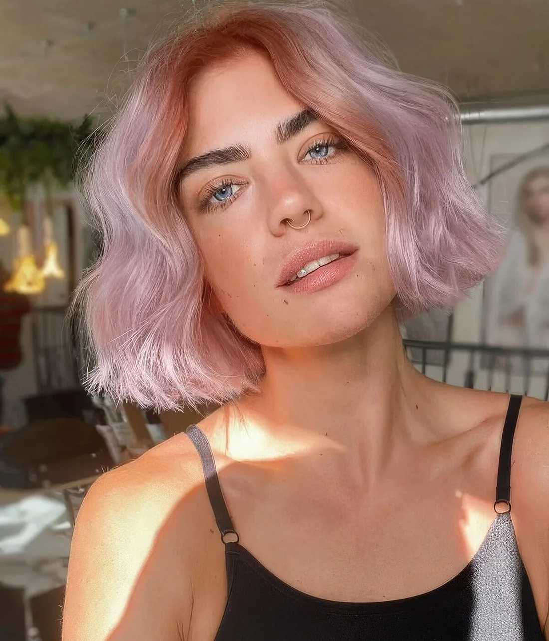 Girlish soft pink midi bob with a wavy volume.