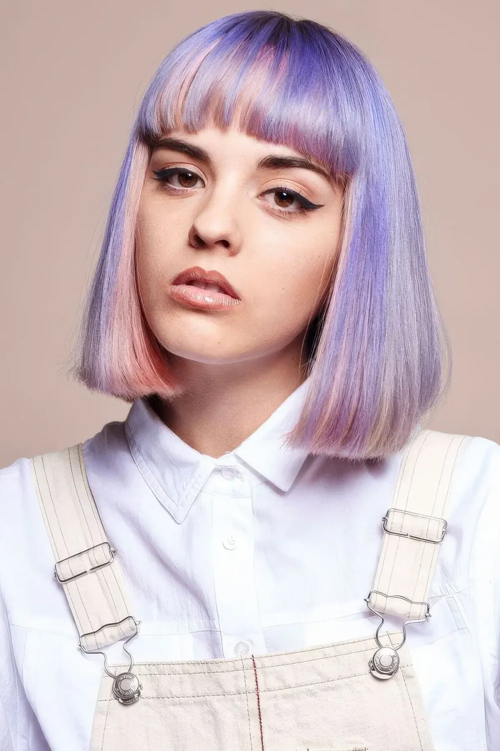 Long pastel bob done in blush and lilac, with a classic fringe.