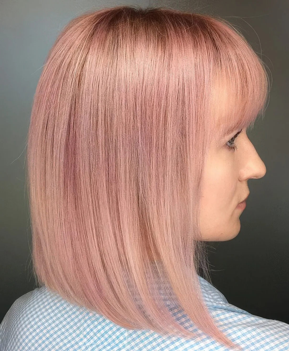 Long straight pastel pink bob with a classic fringe charms with its soft shade.