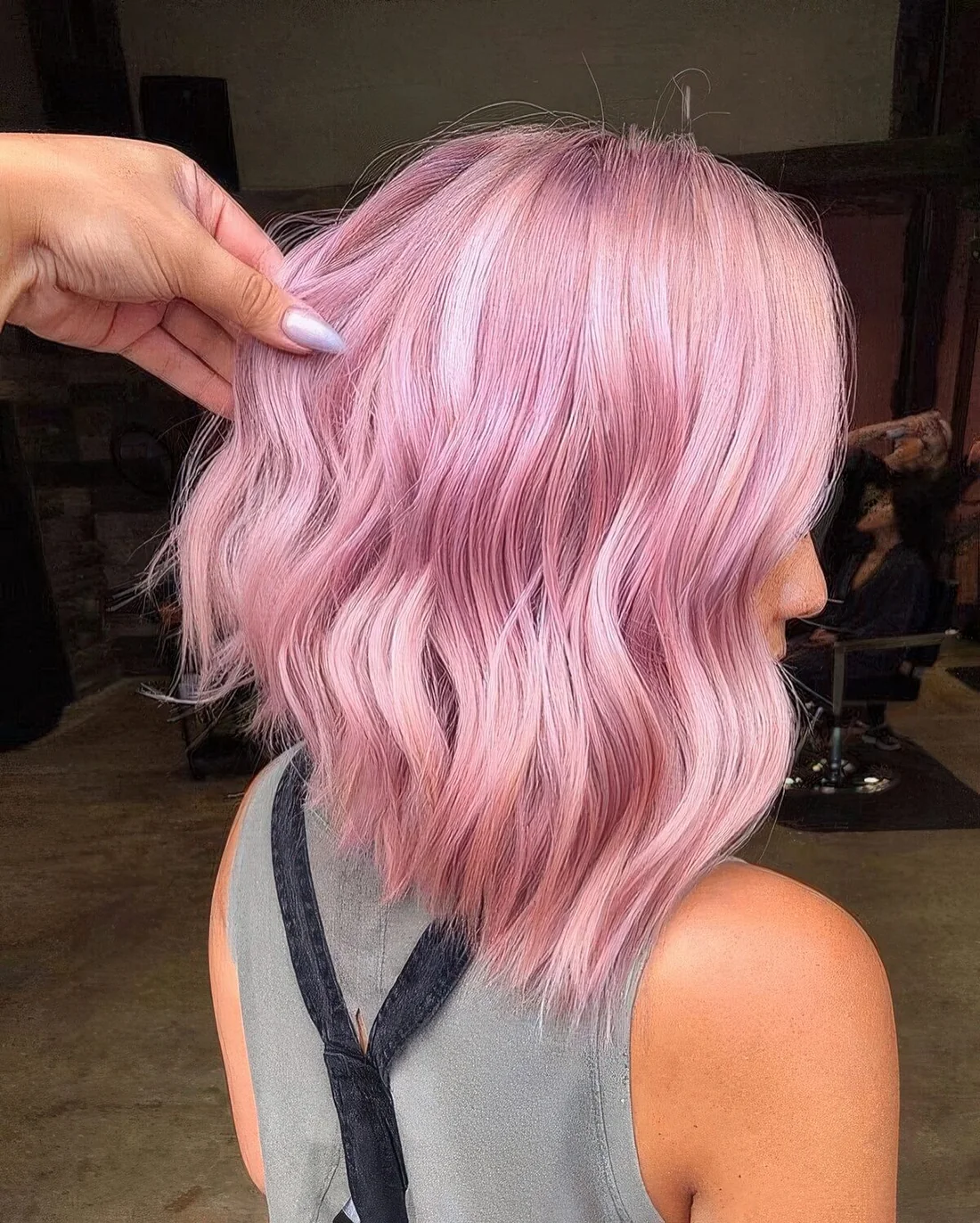 Photo showing line wavy pink long bob, with the hairstyle clearly visible.