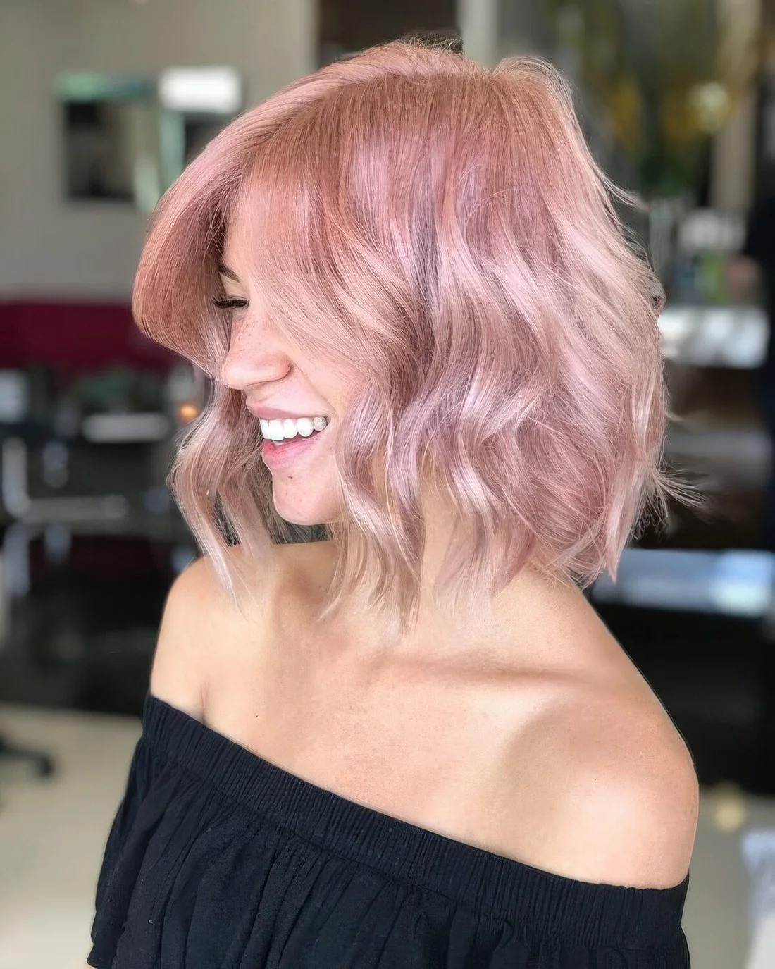Romantic rose wavy long bob with a lot of volume.