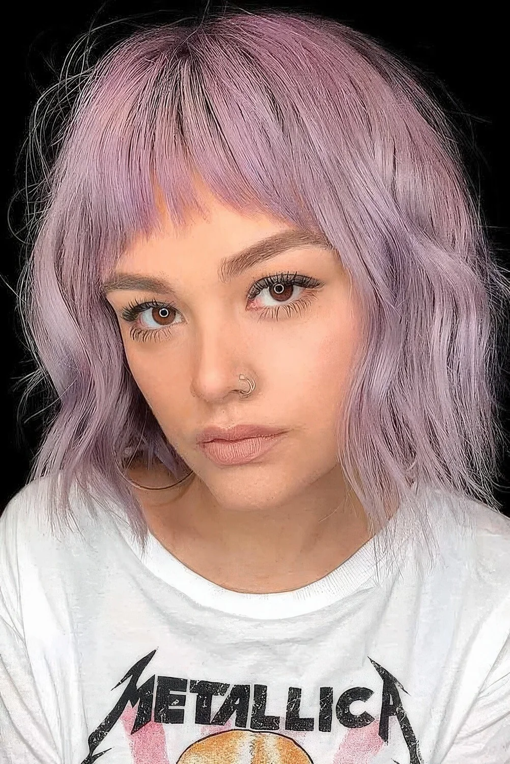 Photo showing bob hairstyle with wispy bangs, with the hairstyle clearly visible.