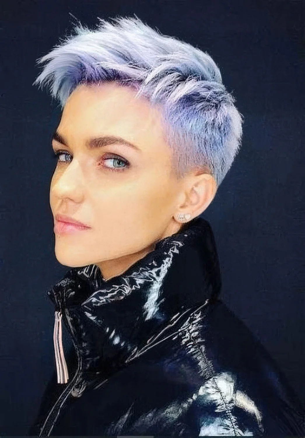 Blue and lilac layered pixie haircut with a lot of volume.
