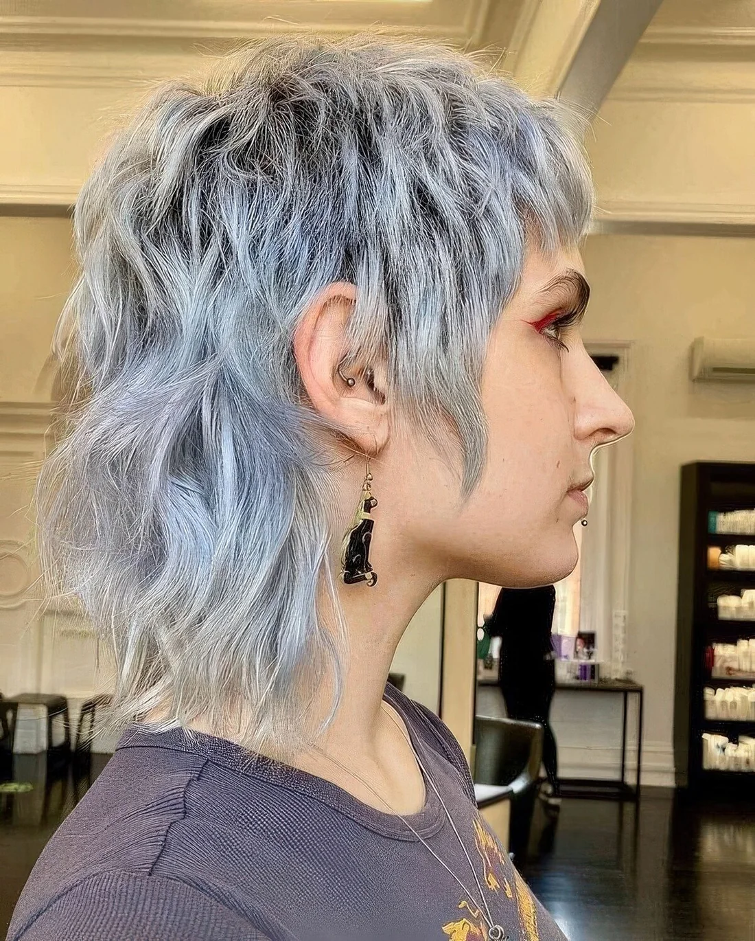 Pale blue short mullet with dimension and waves.