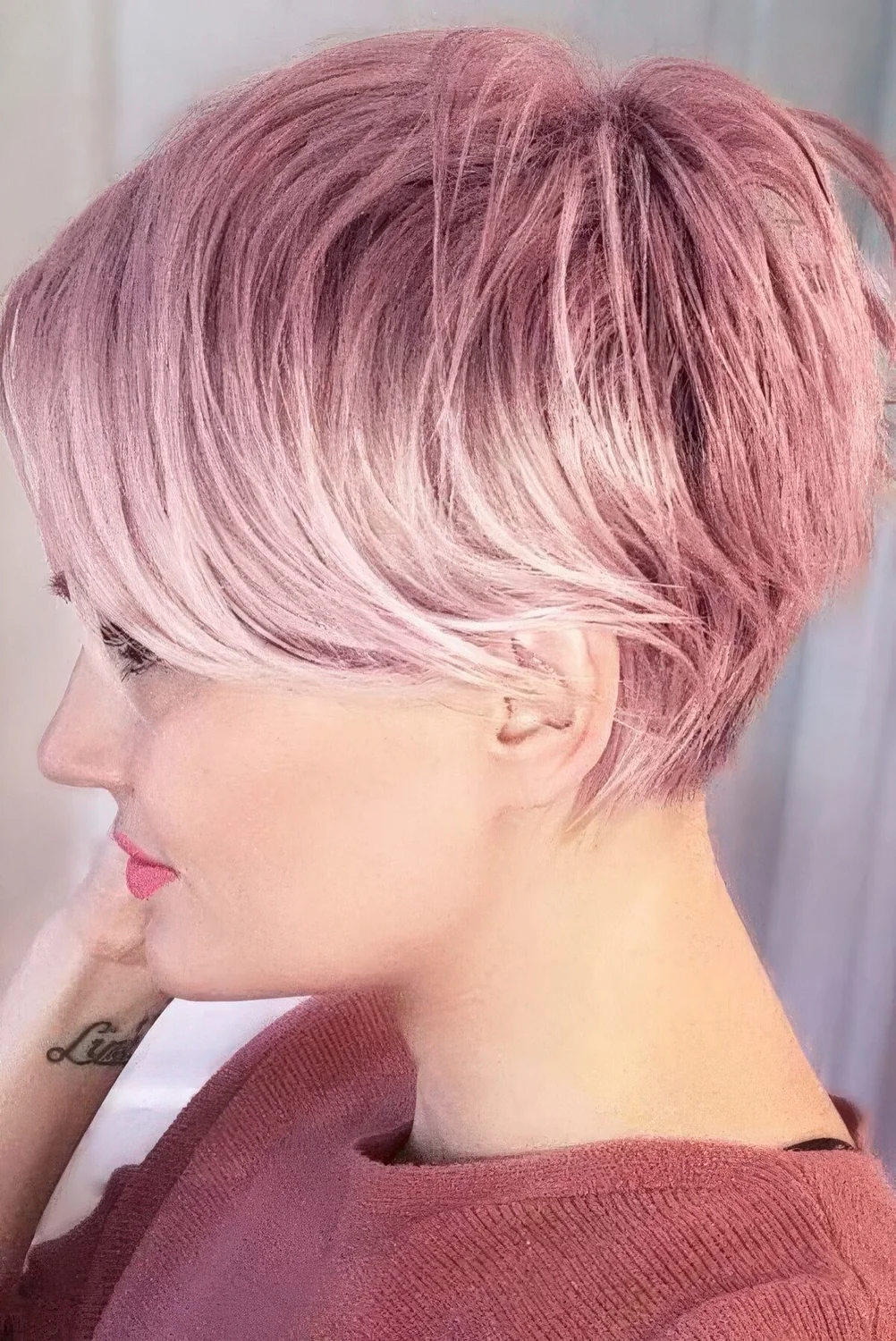 Long pink pixie with long side bangs and a bit of volume.