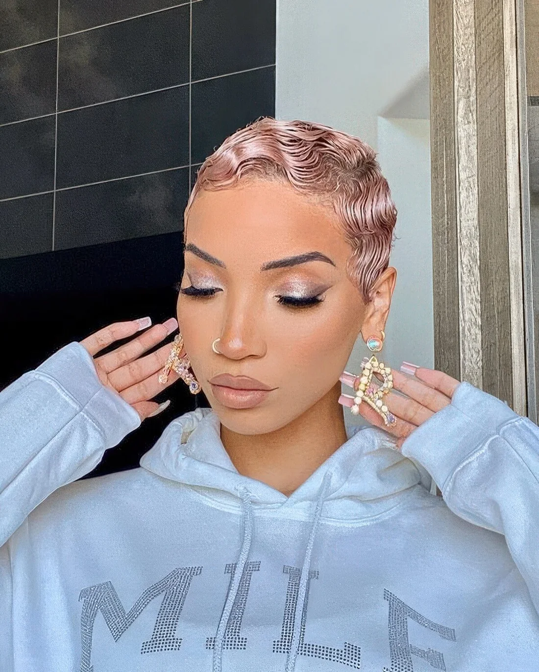Rose gold wavy pixie with Hollywood waves.