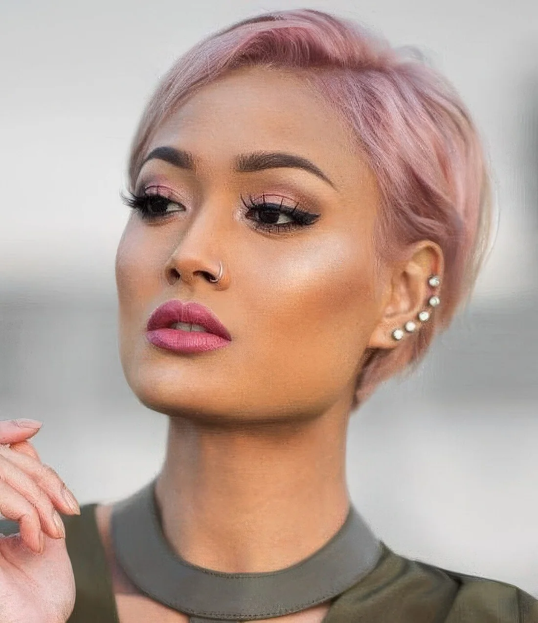 Pastel pink long pixie with side part and a bit of volume.