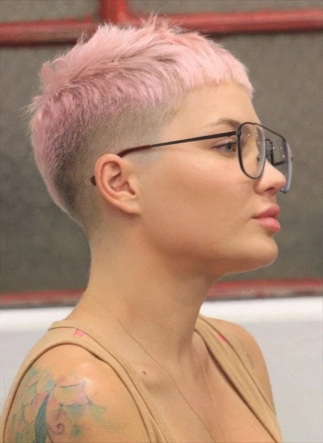 Pastel pixie haircut with an undercut and baby bangs.
