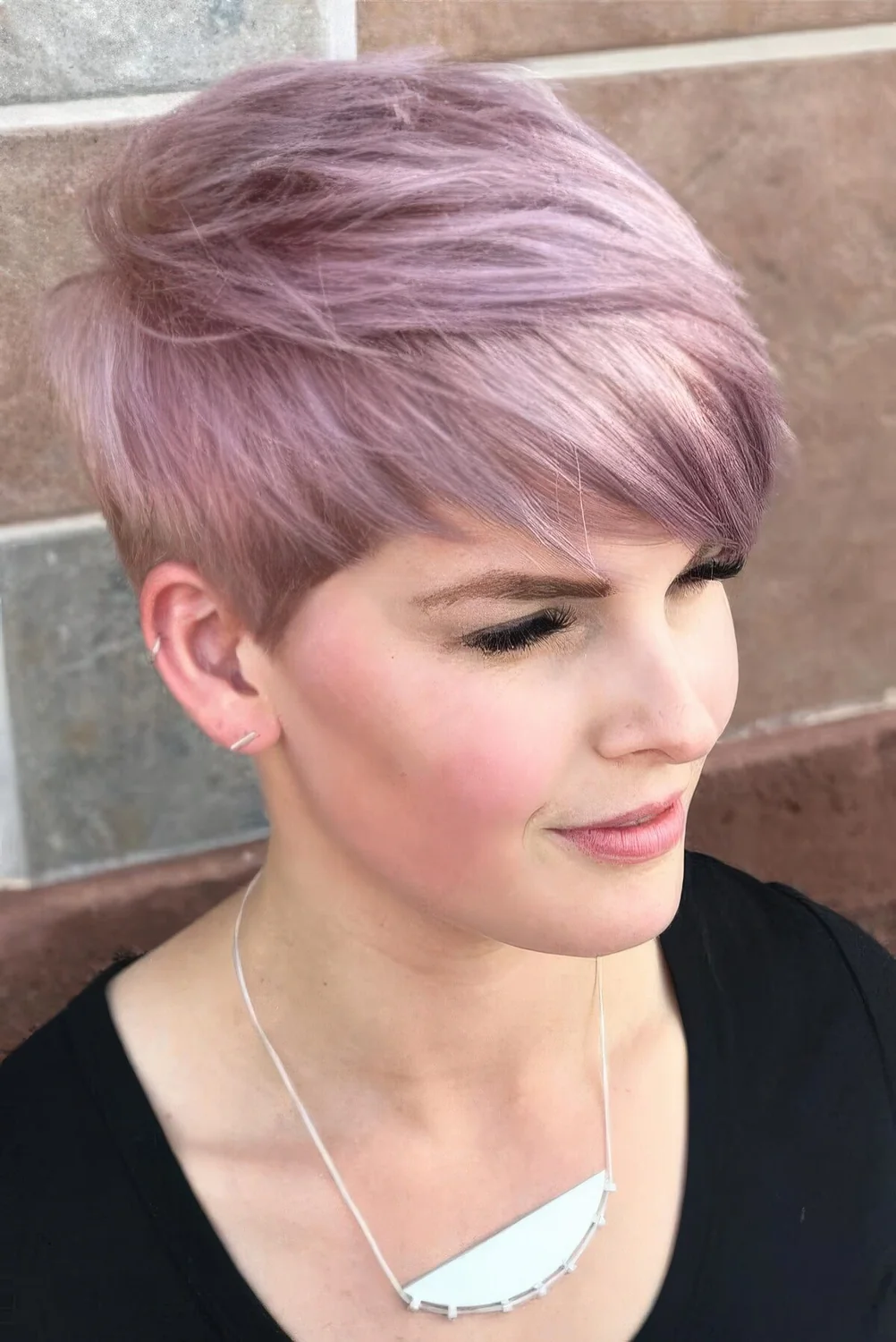 Long pixie with a lilac to blush shade and long fringe.