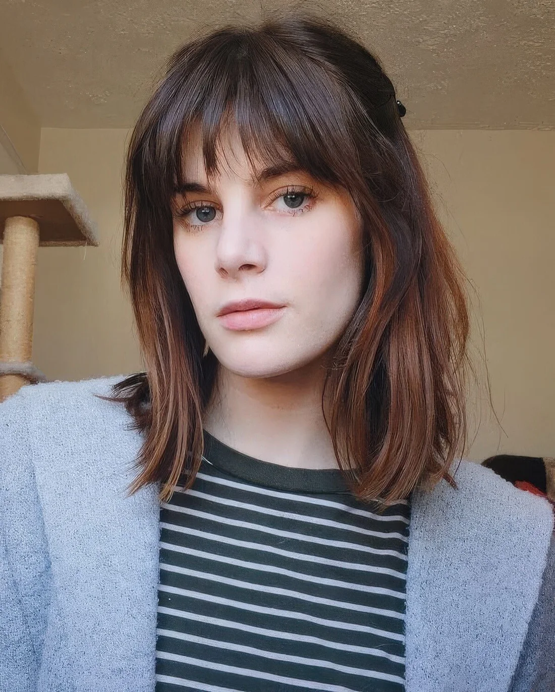 Photo showing airy piecey wispy bangs, with the hairstyle clearly visible.