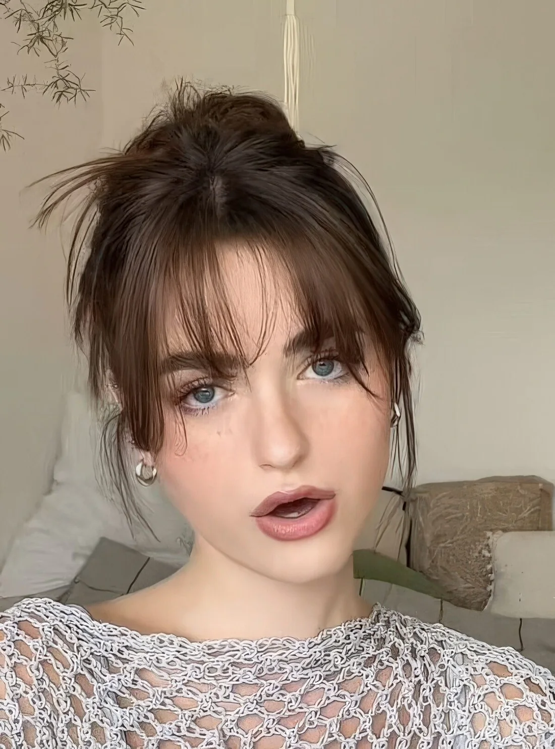 Photo showing layered bangs, with the hairstyle clearly visible.