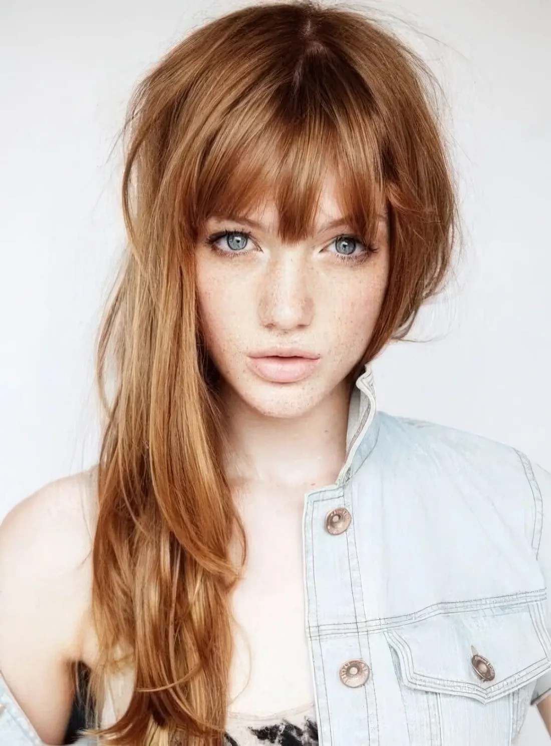 Photo showing layered cut piecey bangs, with the hairstyle clearly visible.