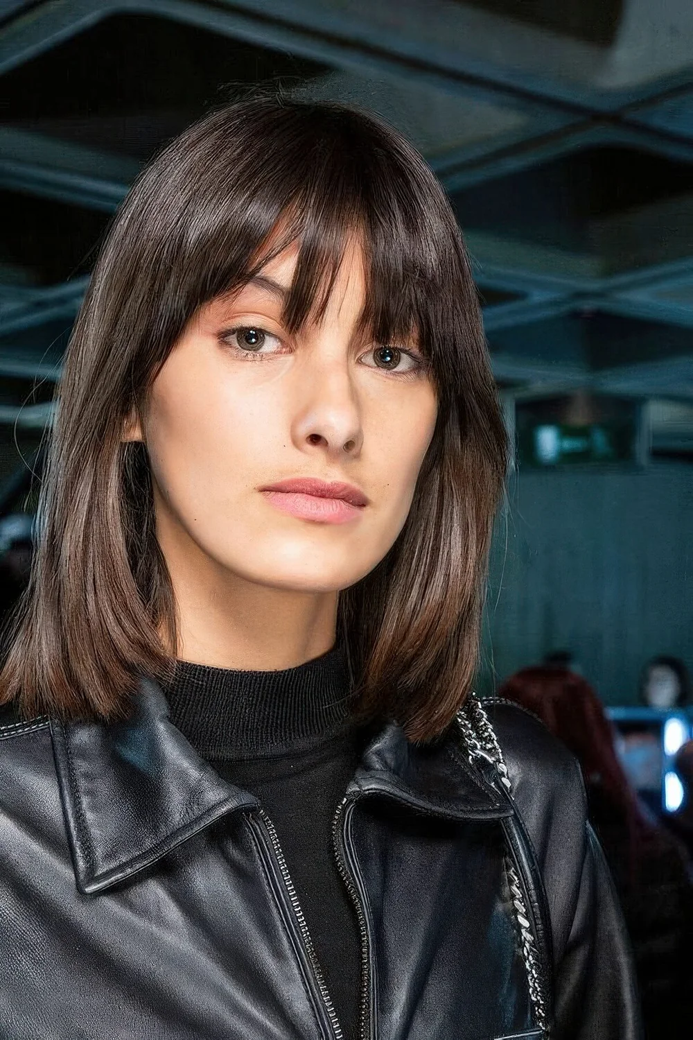 Photo showing long bob piecey bangs, with the hairstyle clearly visible.