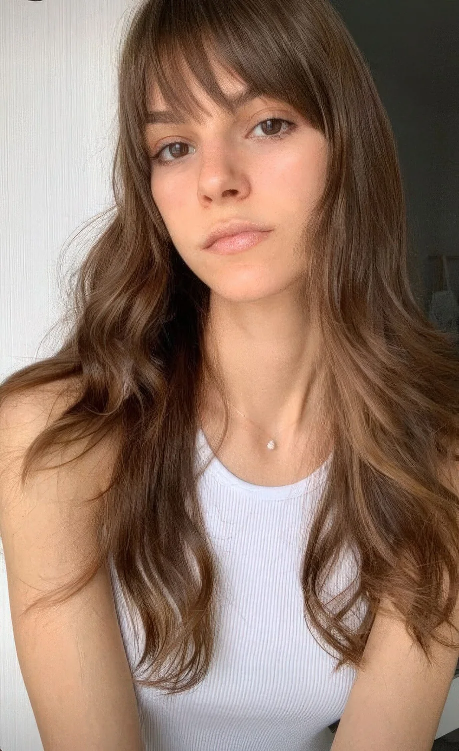 Photo showing long hair piecey bangs, with the hairstyle clearly visible.
