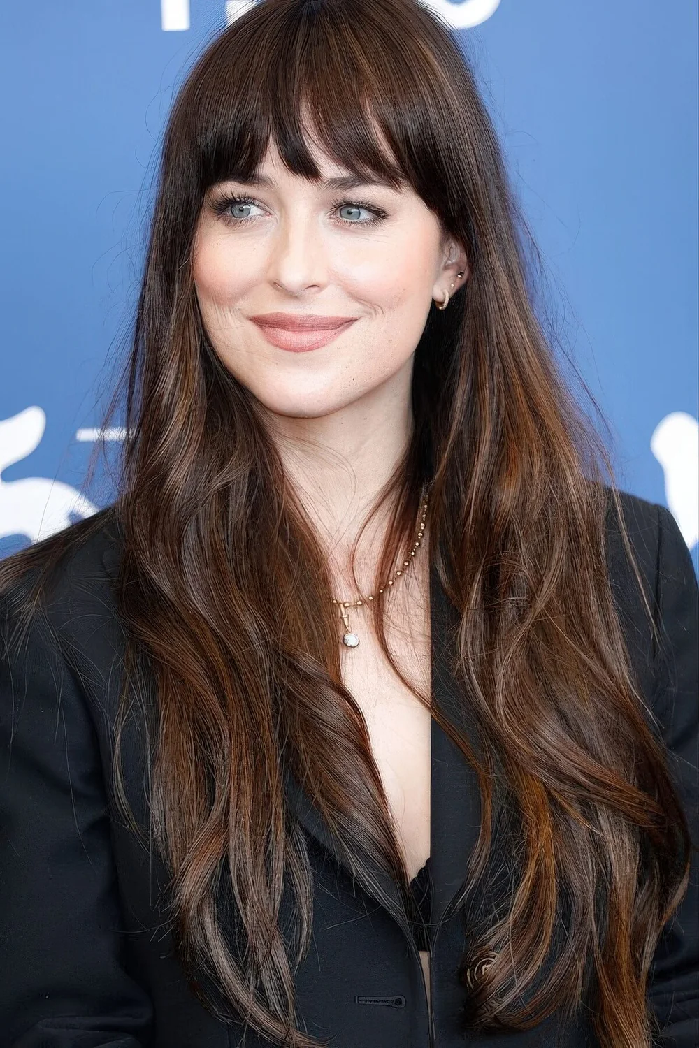 Photo showing long wavy hair piece bangs, with the hairstyle clearly visible.