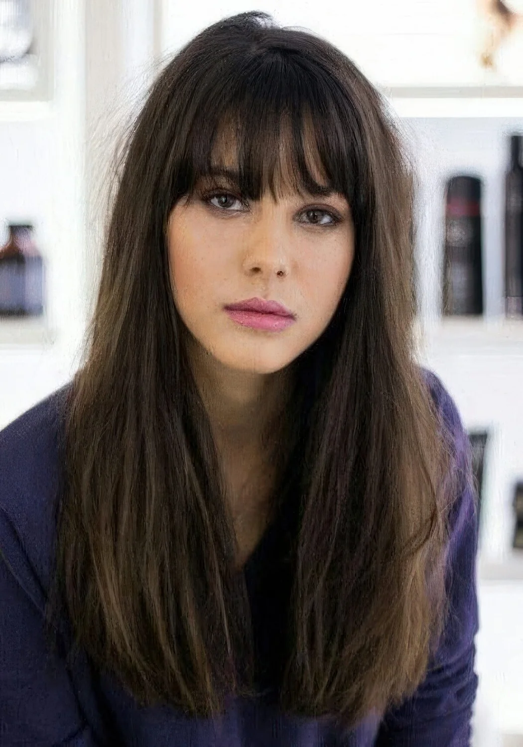 Photo showing outgrown piecey bangs, with the hairstyle clearly visible.