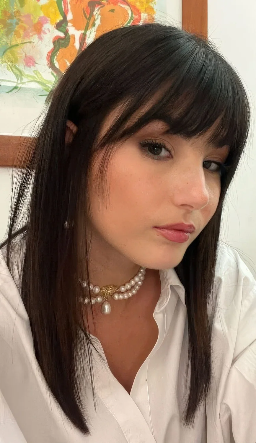 Photo showing piecey and wispy fringe, with the hairstyle clearly visible.