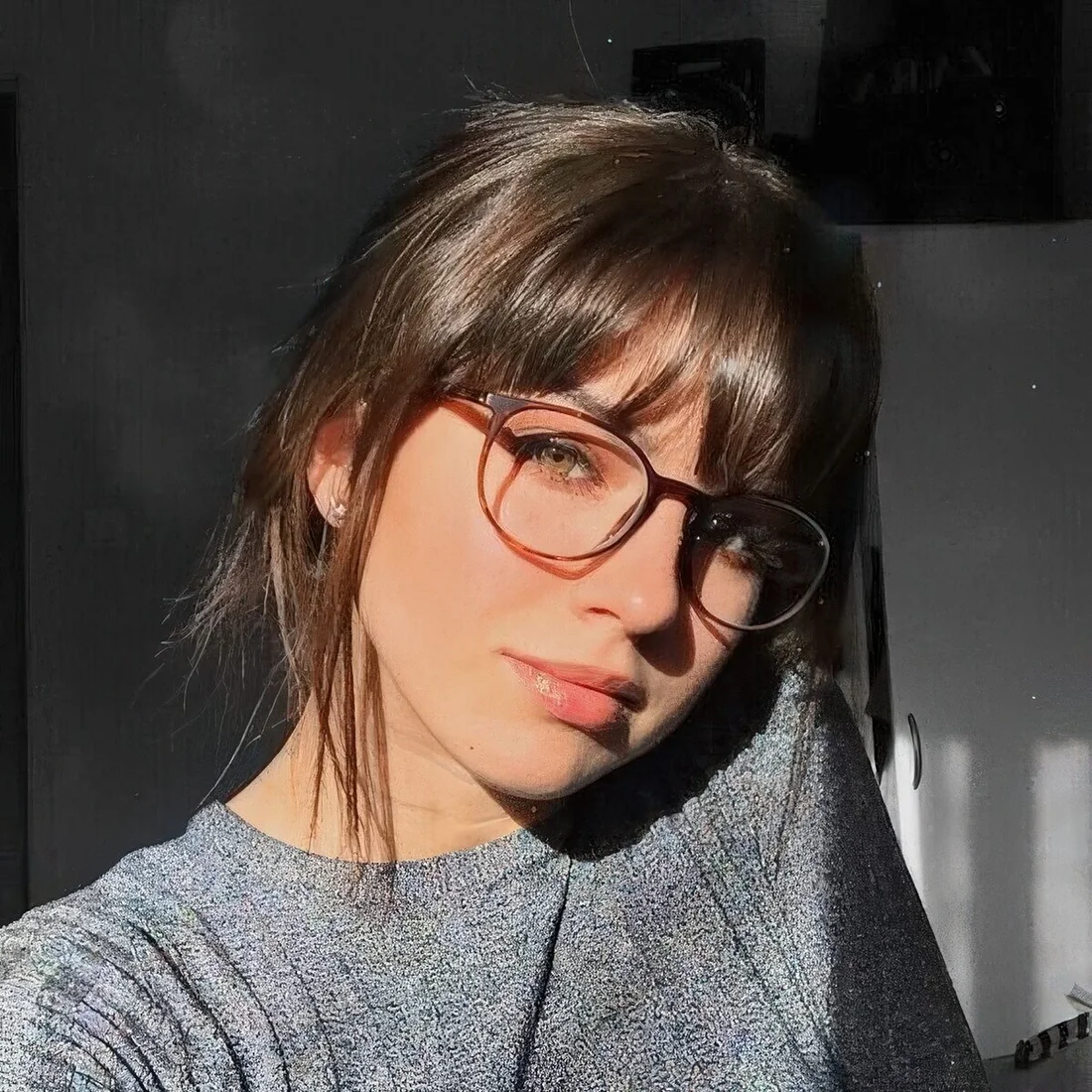 Photo showing piecey bangs to frame the face, with the hairstyle clearly visible.