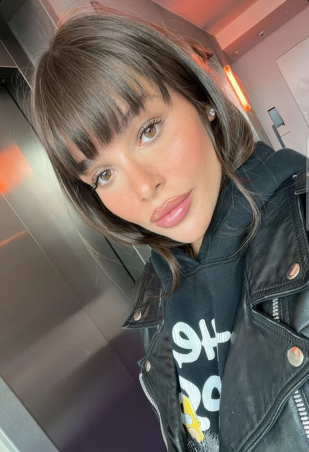 Photo showing piecey long bangs, with the hairstyle clearly visible.