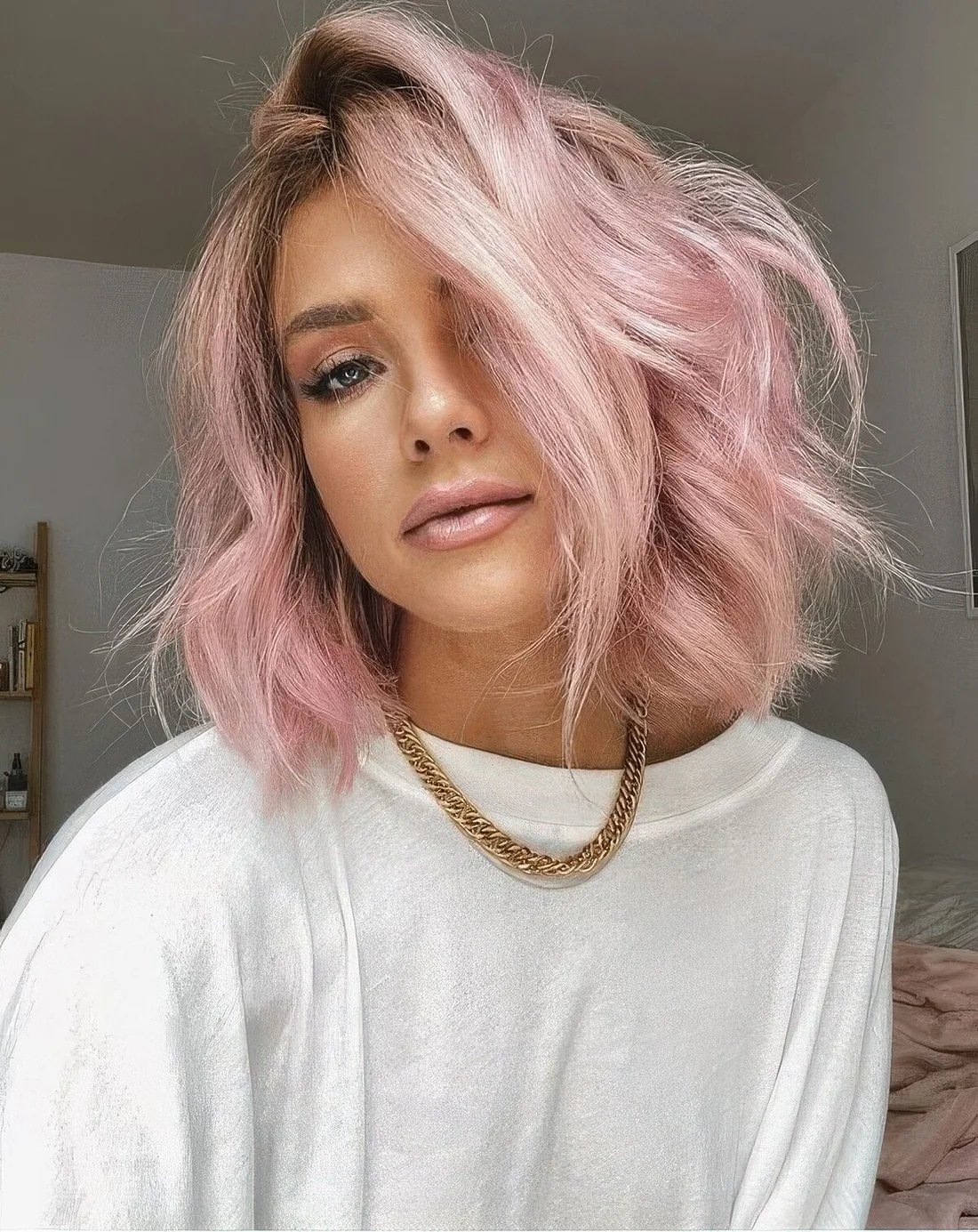 Textural long bob in a soft shade of pink, with texture, volume and waves.
