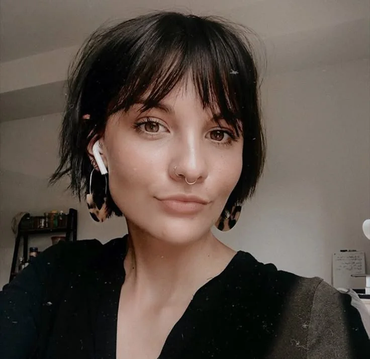 Photo showing bottleneck bangs, with the hairstyle clearly visible.