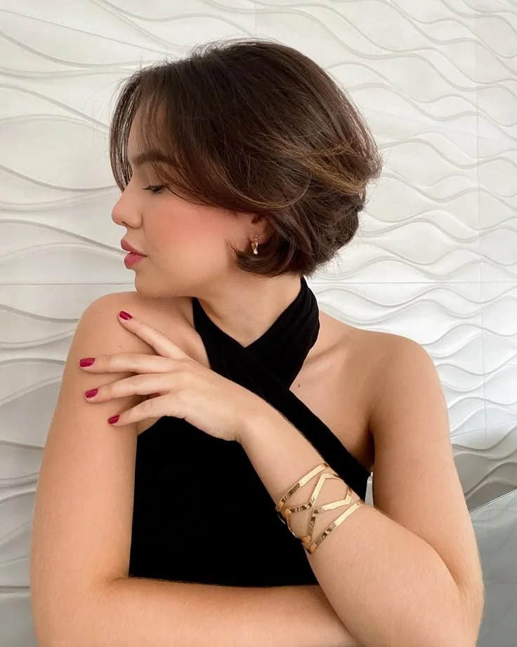 Photo showing long curtain bangs, with the hairstyle clearly visible.
