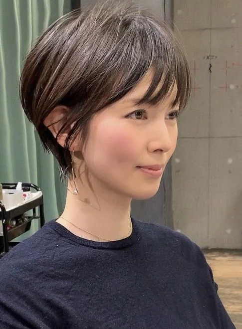 Photo showing pixie wispy bangs, with the hairstyle clearly visible.