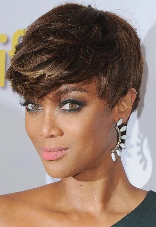 ear straight golden pixie with wispy fringe shown as a pixie with bangs idea