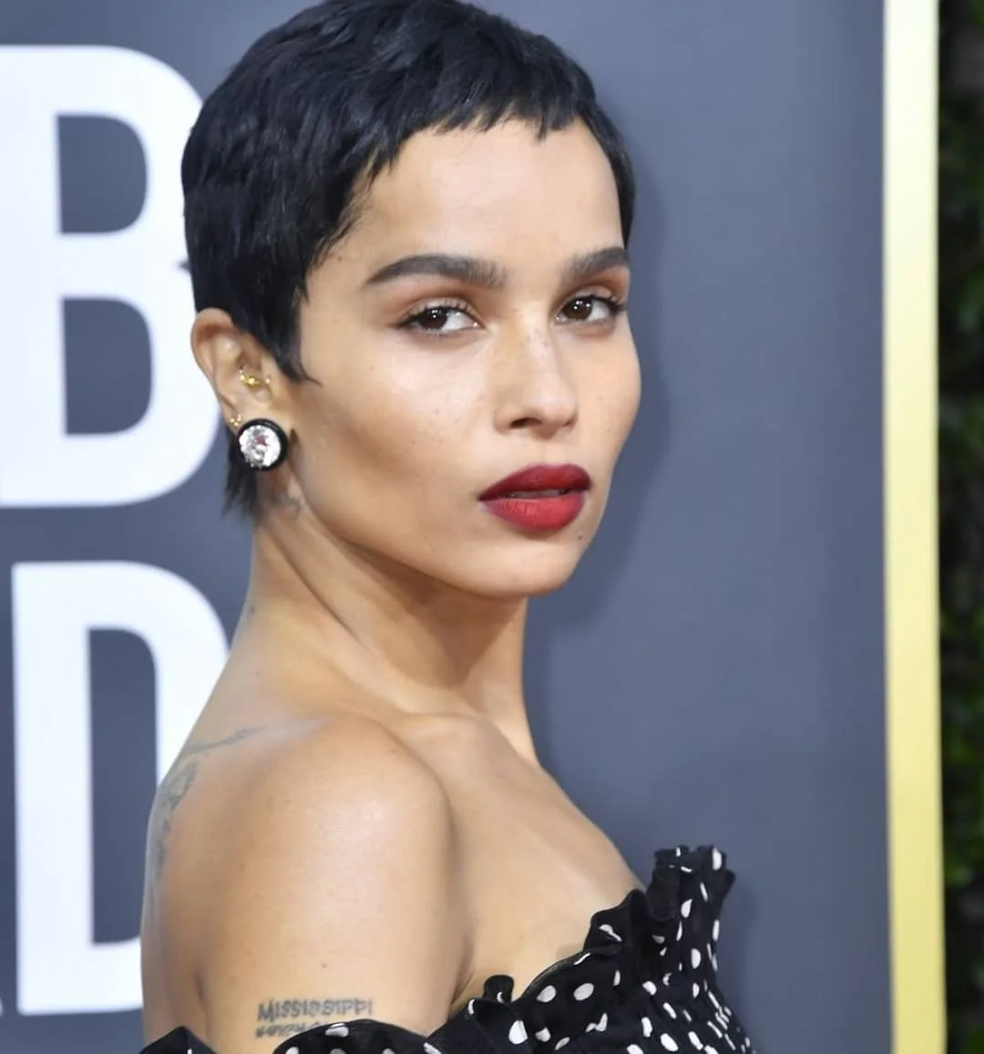 ear straight black pixie with side swept fringe shown as a pixie with bangs idea
