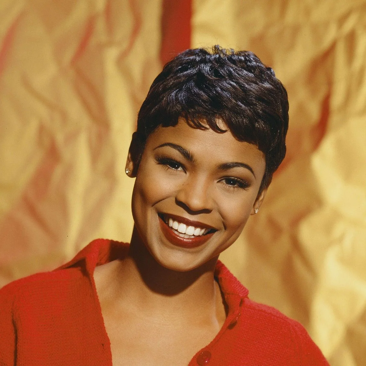 ear straight black pixie with side swept fringe shown as a pixie with bangs idea, featuring side swept fringe