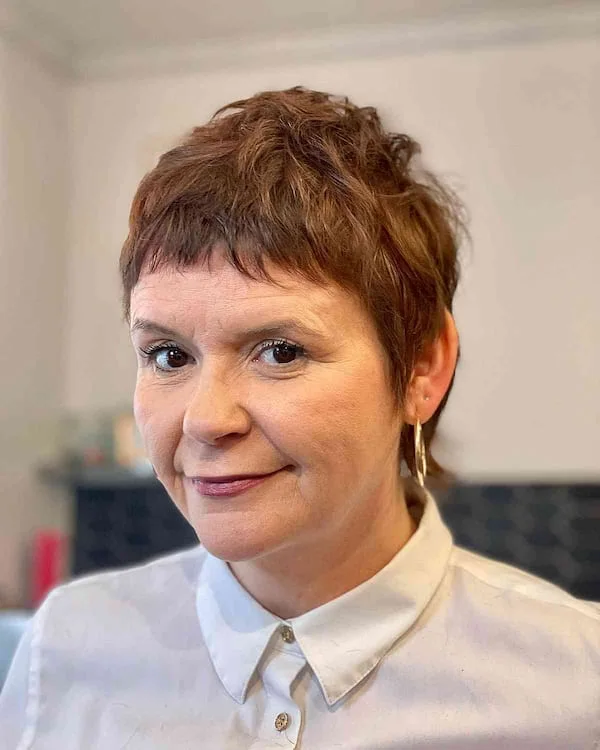 ear straight chestnut pixie with micro fringe shown as a pixie with bangs idea