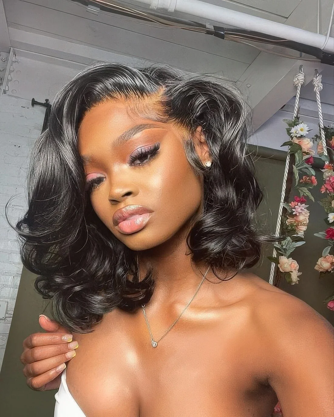 Photo showing curly black bob, with the hairstyle clearly visible.