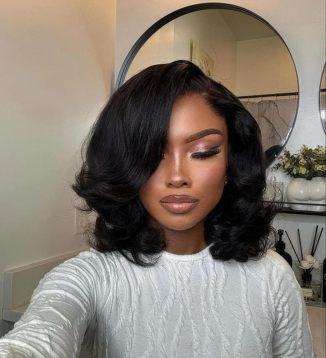 Photo showing refined black plush bob, with the hairstyle clearly visible.