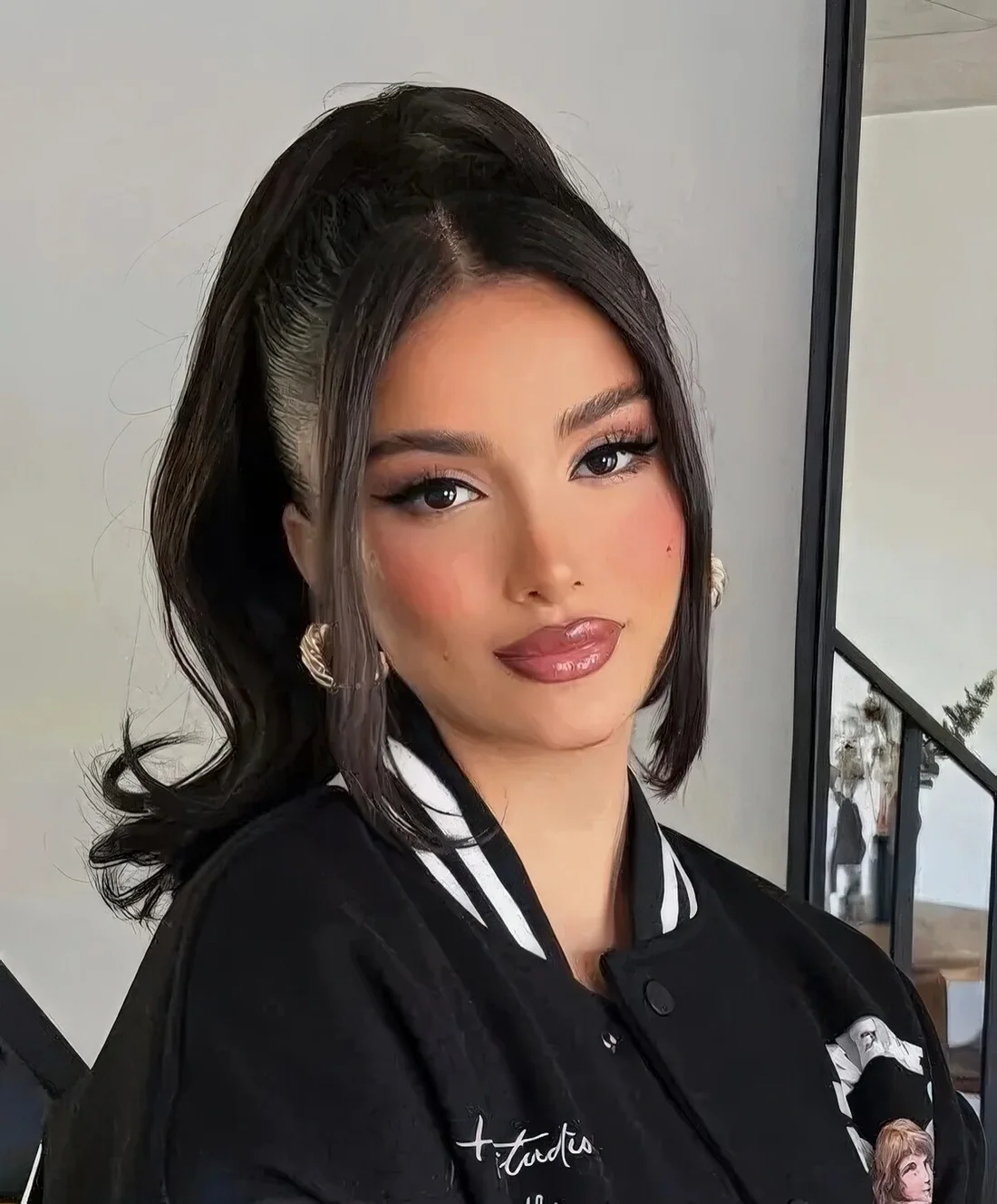 High ponytail with hair down and face-framing hair.