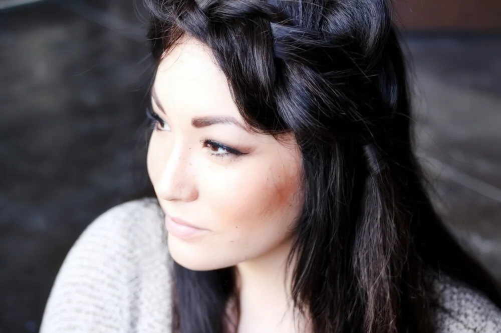 Loose dark side braid with a swept front.