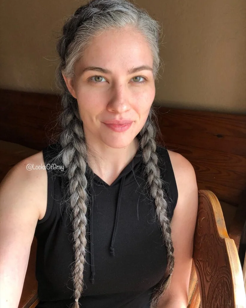 Photo showing long Gray Double Braids, with the hairstyle clearly visible.