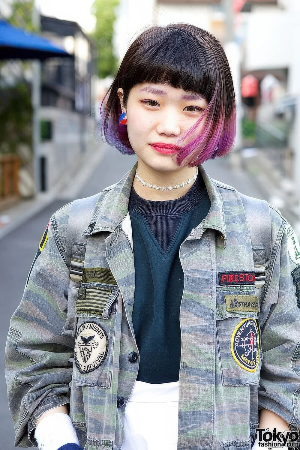 Black chin-length bob with purple dip dyed hair and bangs.
