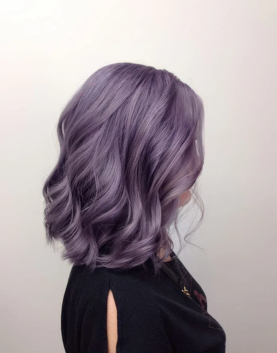 Lavender long bob with waves and side part.