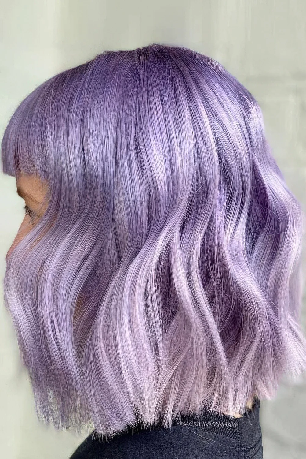 Photo showing purple ombre bob hairstyle, with the hairstyle clearly visible.