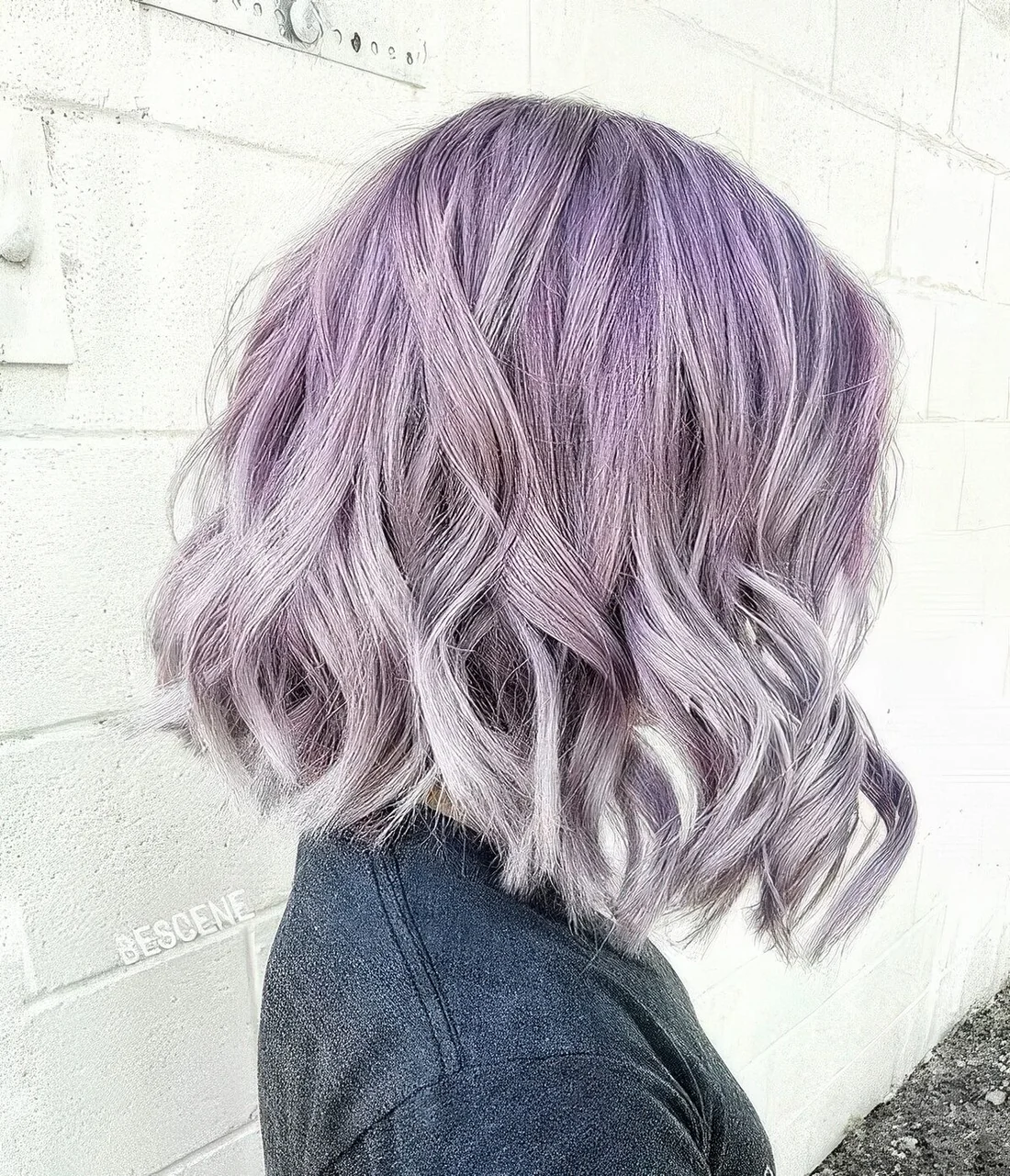 Lilac to silver ombre long bob with waves.
