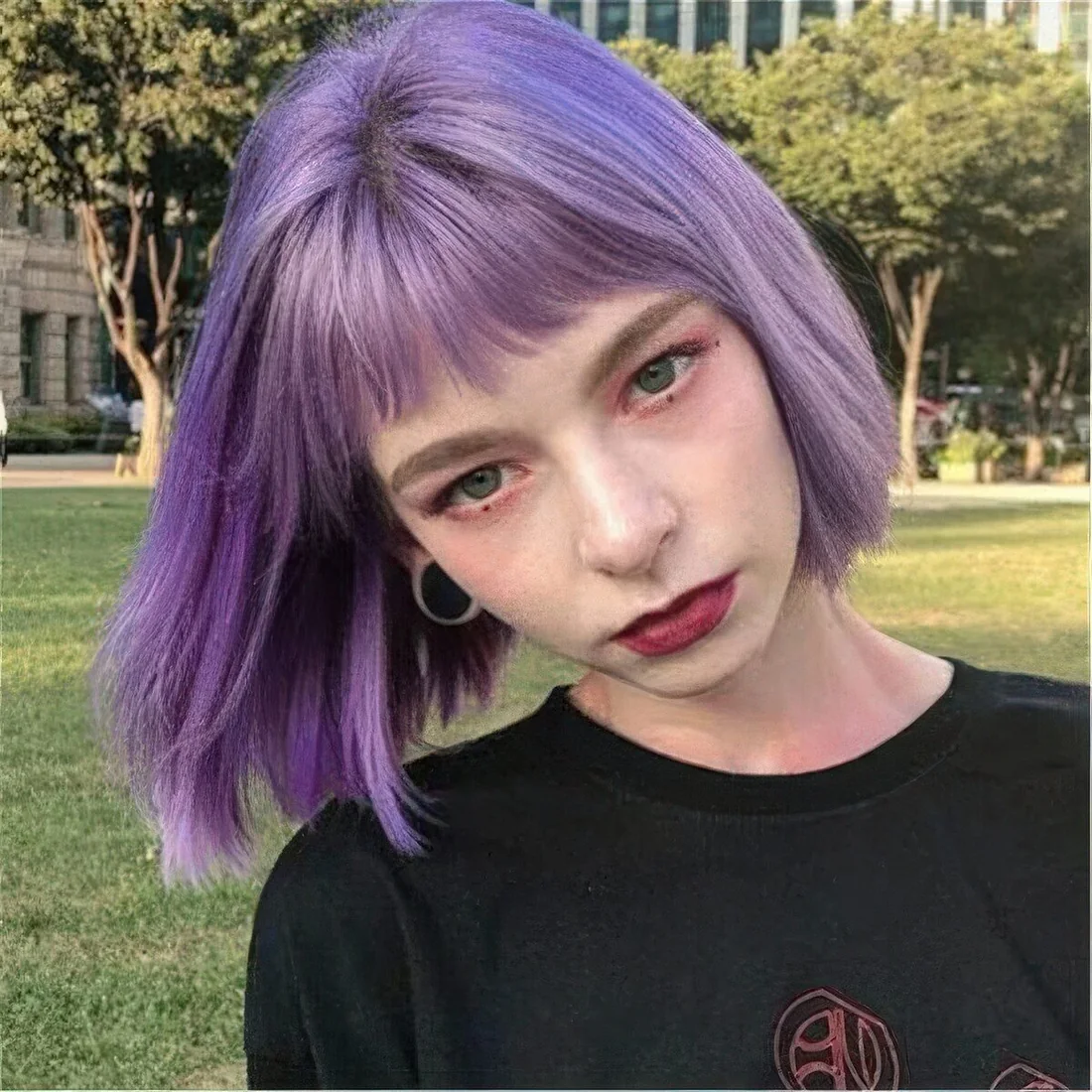 Lavender chin-length bob with bangs and a bit of textured volume.