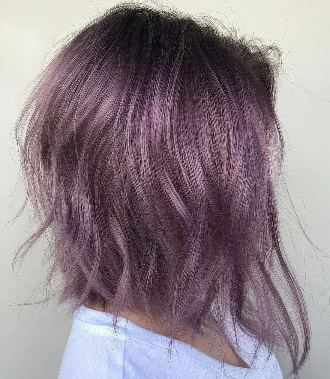 Photo showing messy wavy long bob in lavender, with the hairstyle clearly visible.