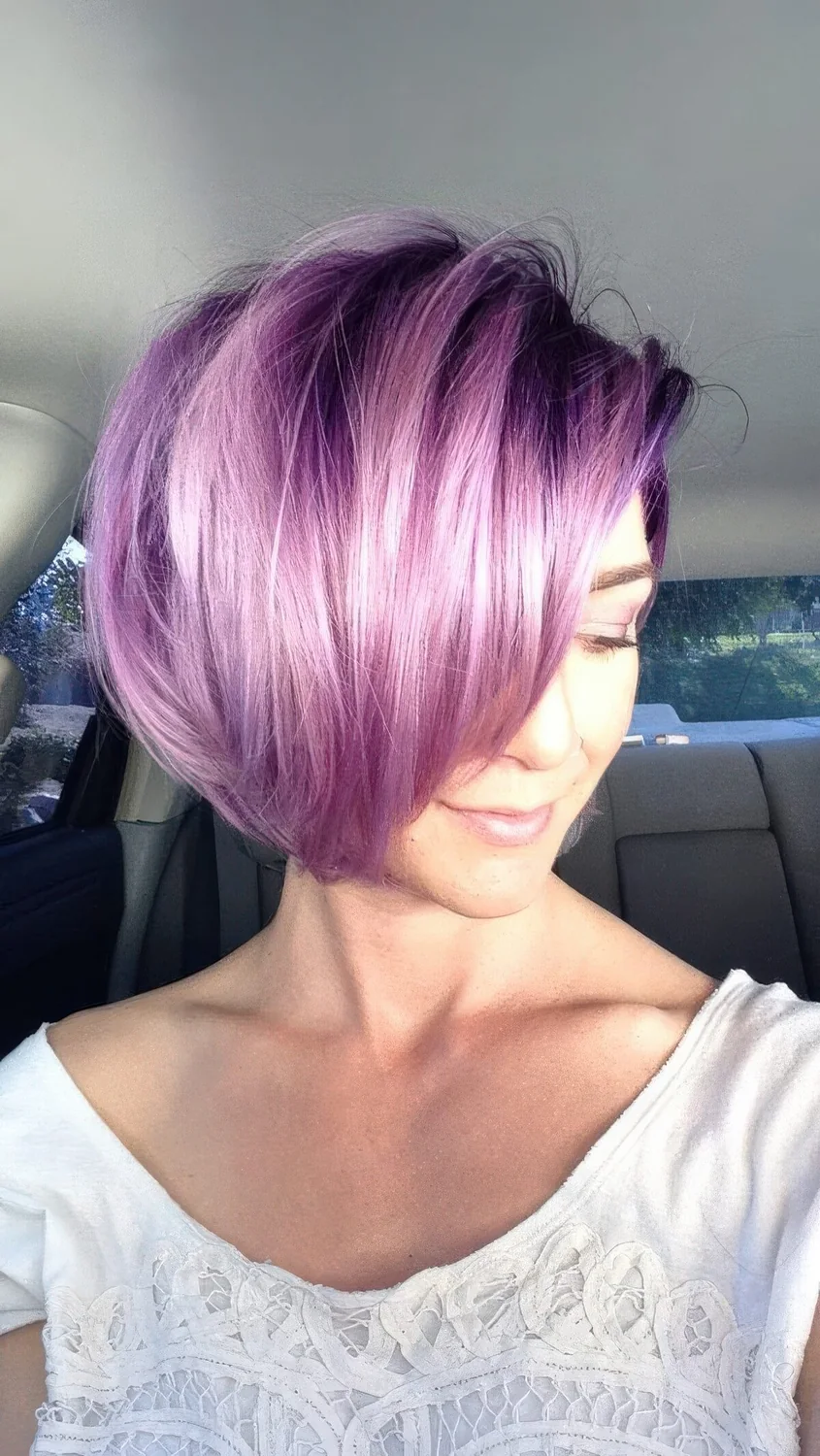 Photo showing purple angled bob hairstyle, with the hairstyle clearly visible.