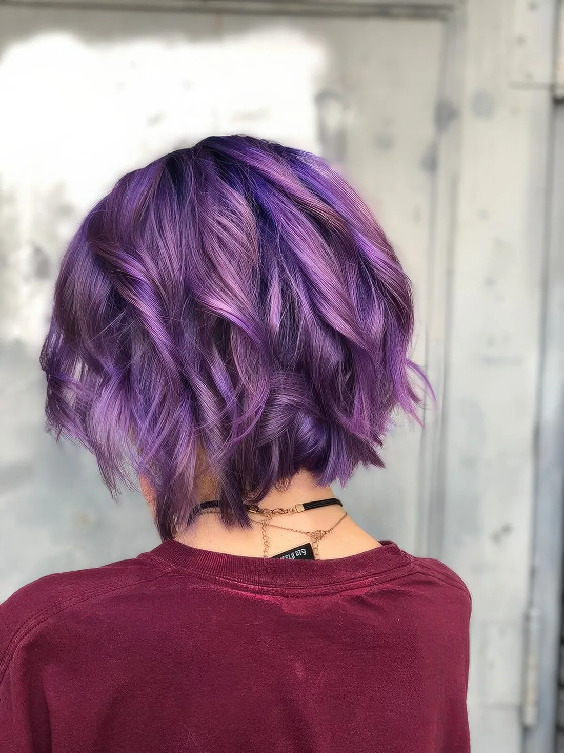 Purple chopped wavy bob with waves.