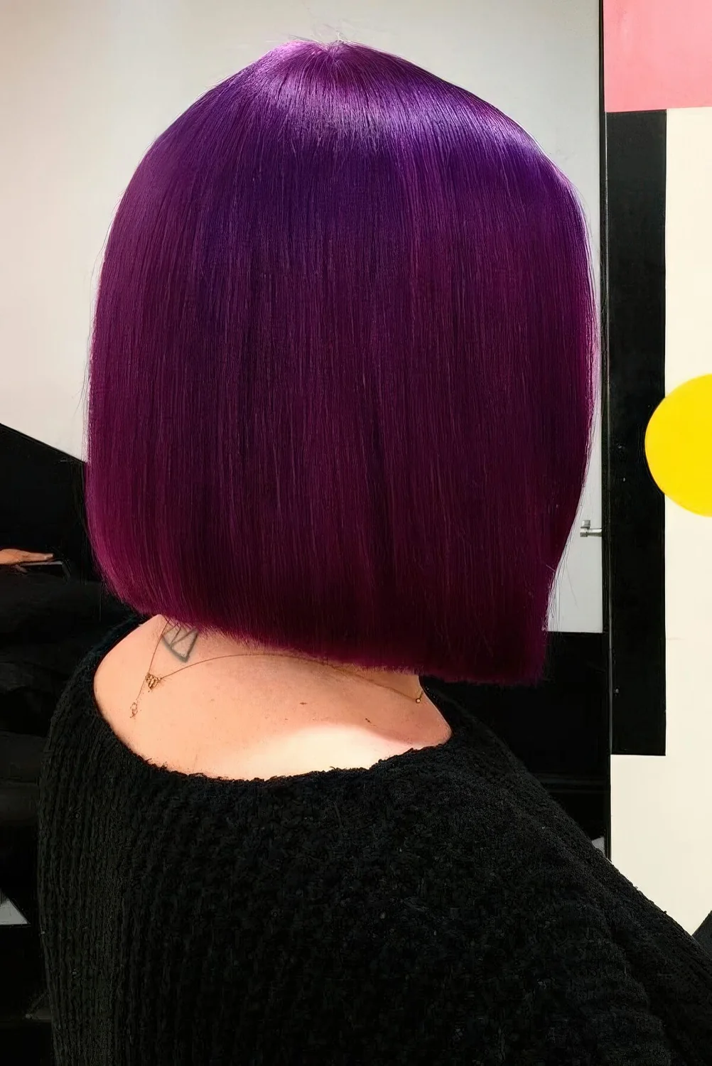 Deep purple straight and shiny long bob.