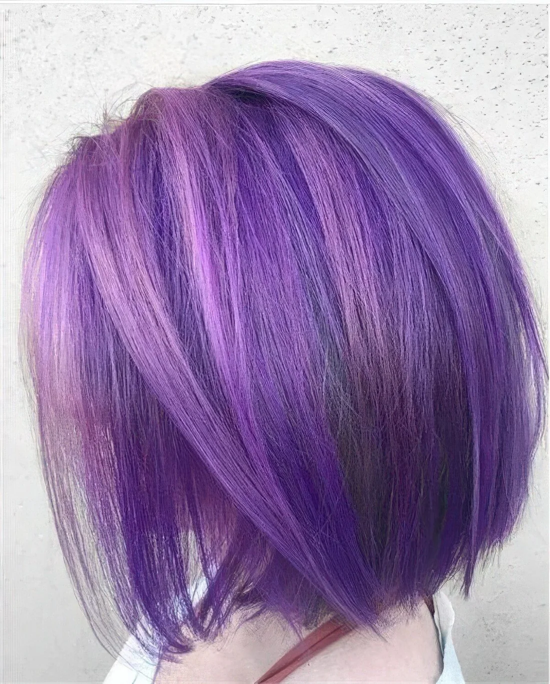 Photo showing ultra violet straight long bob, with the hairstyle clearly visible.