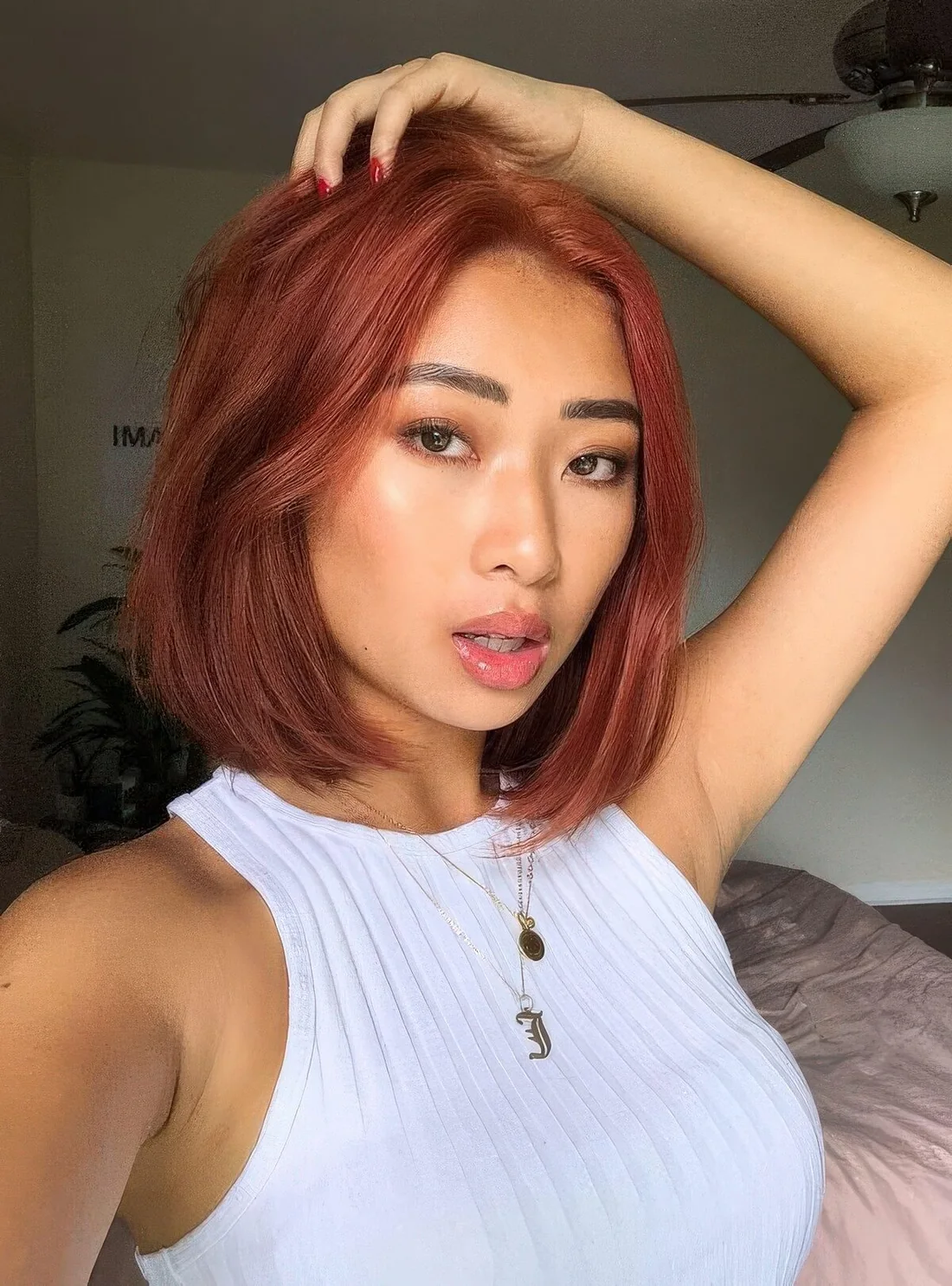 Sleek red long bob with slightly curved ends.