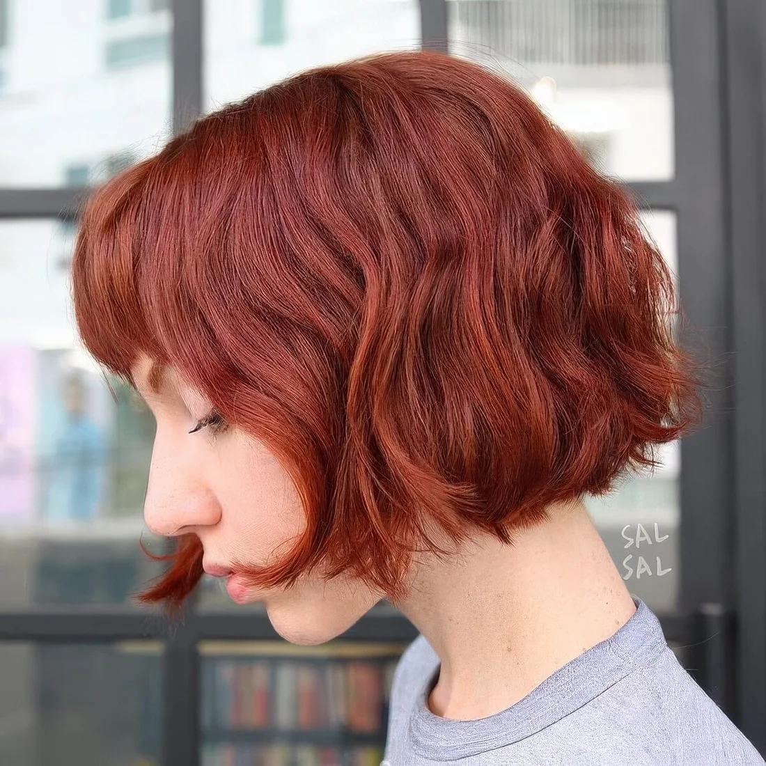 Wavy jaw-length bob with a blunt fringe.