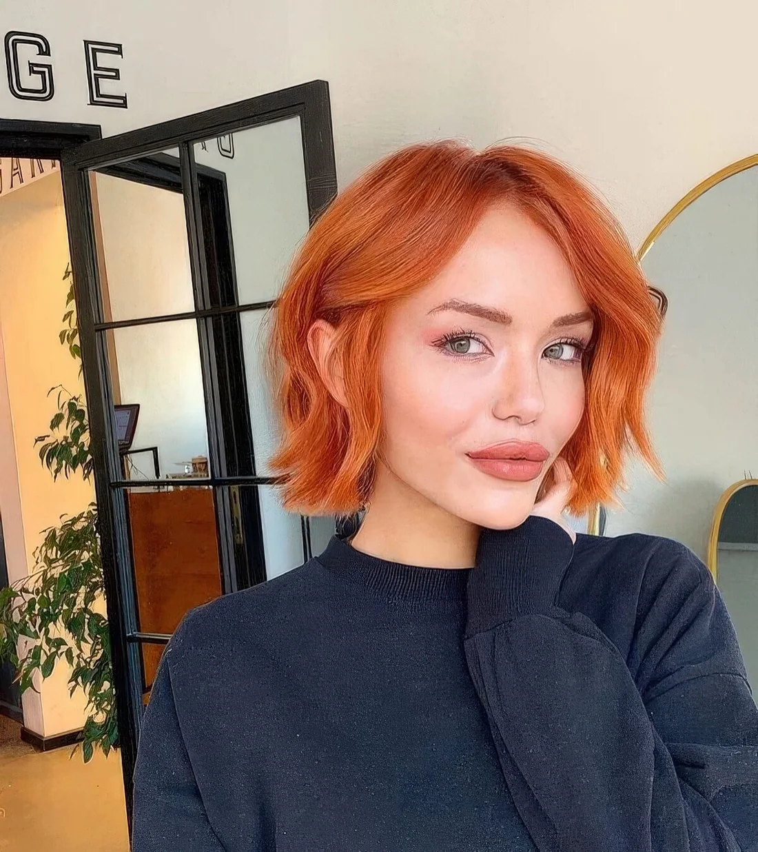 Copper red chin-length bob with a bit of waves.