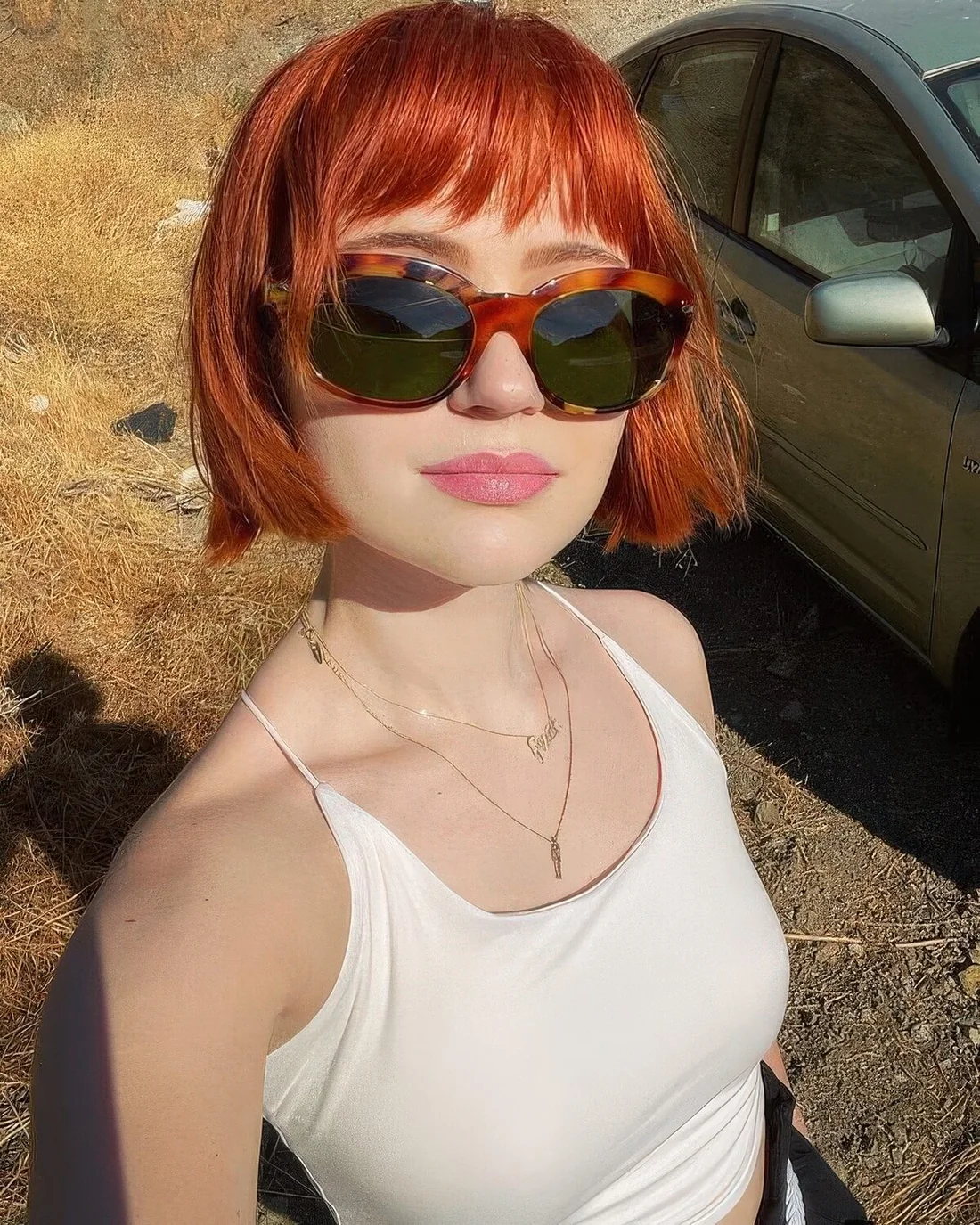 Red jaw-length bob with a messy fringe and a bit of texture.